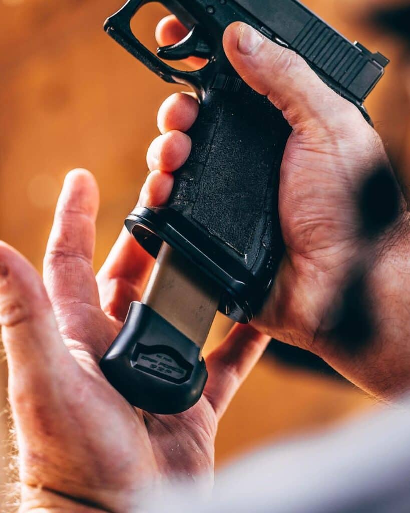 Glock mag extensions in use.